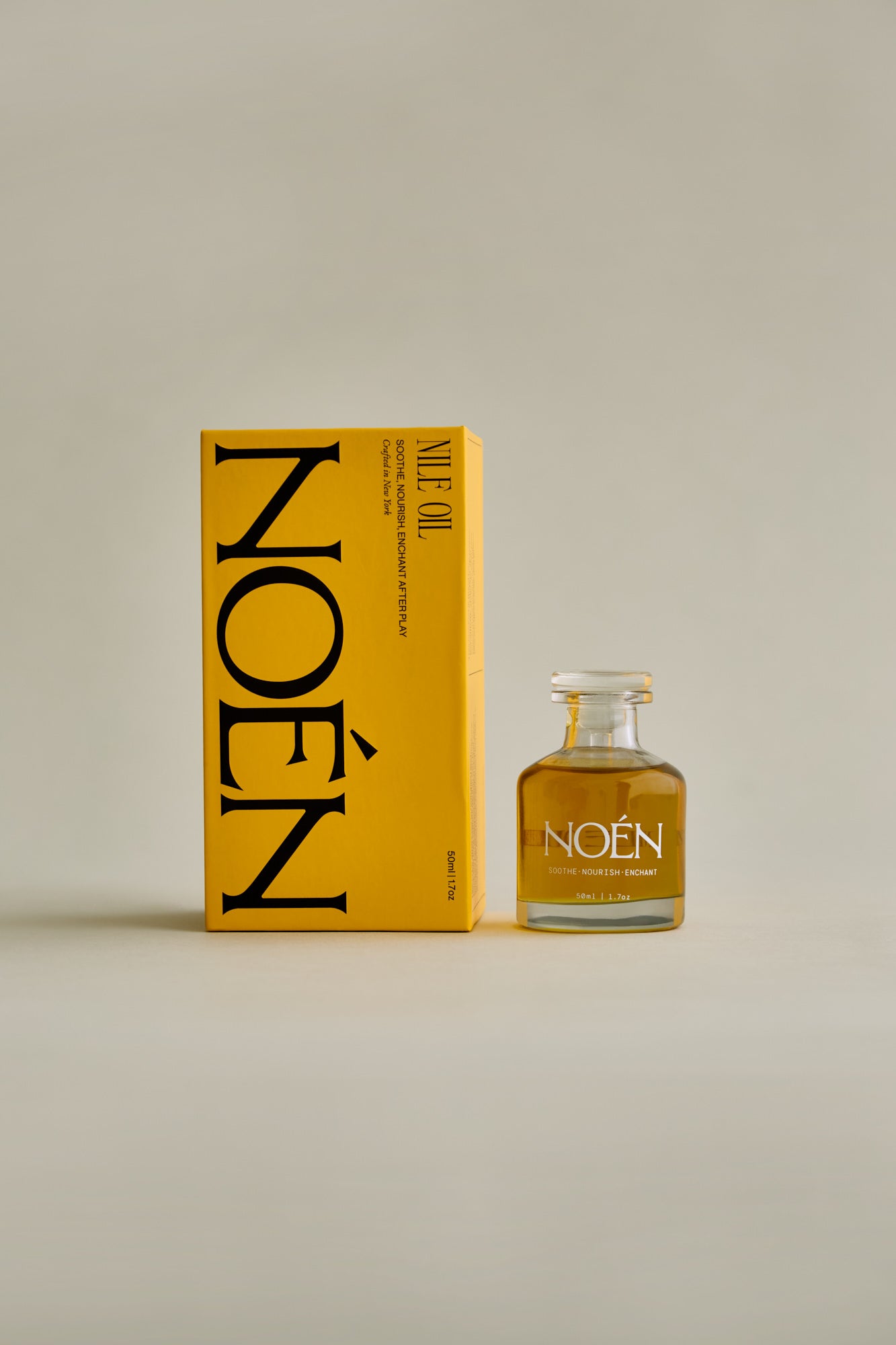 A bottle of Afterplay Oil by Noén, a luxurious intimacy oil formulated with a blend of natural ingredients including beta-caryophyllene, calendula, moringa, buriti fruit, and rosemary. This soothing and rejuvenating oil is designed to hydrate, calm, and revitalize the skin after sex or other intimate moments.