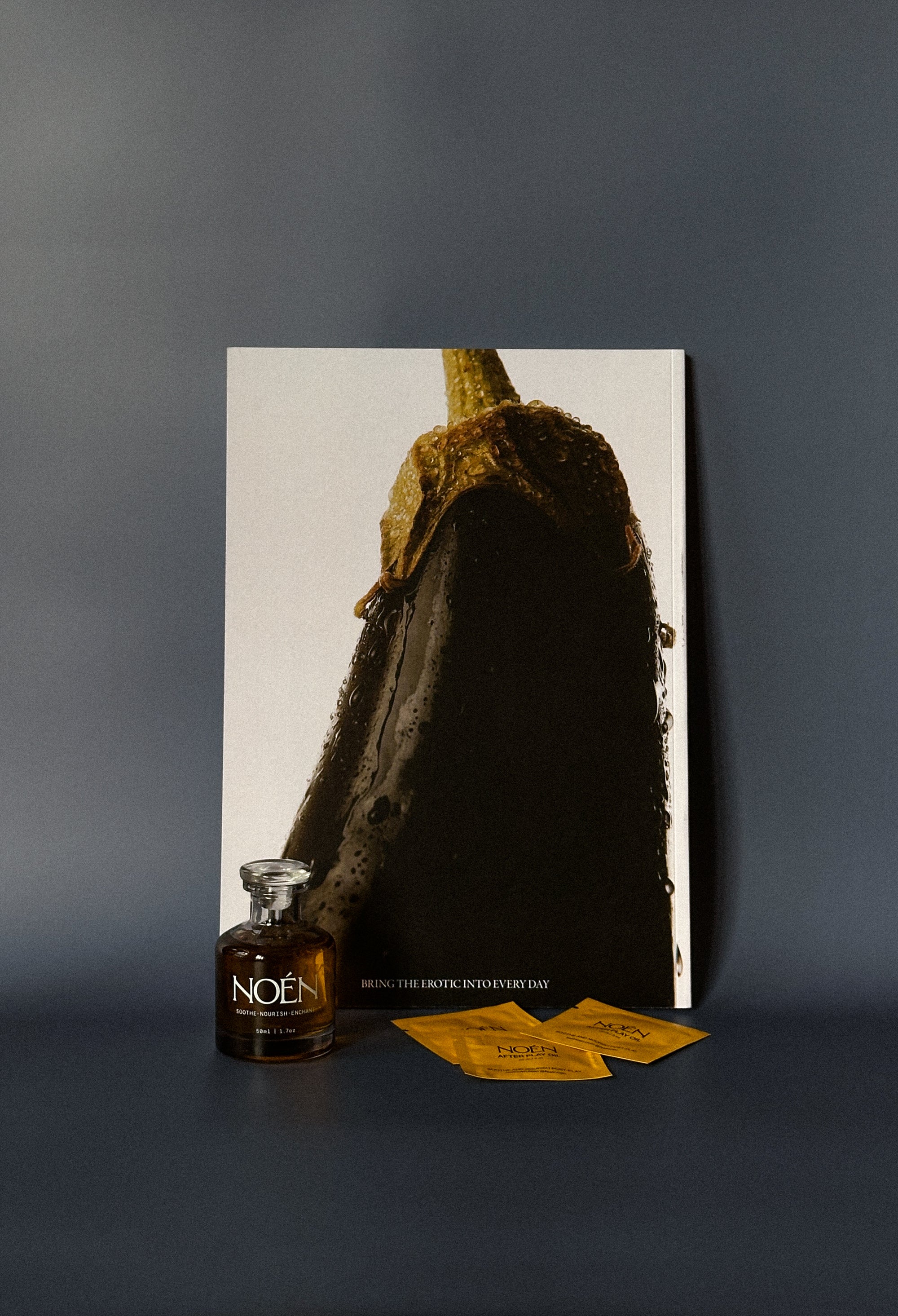 Noen bottle with their publication and travel sized sachets.